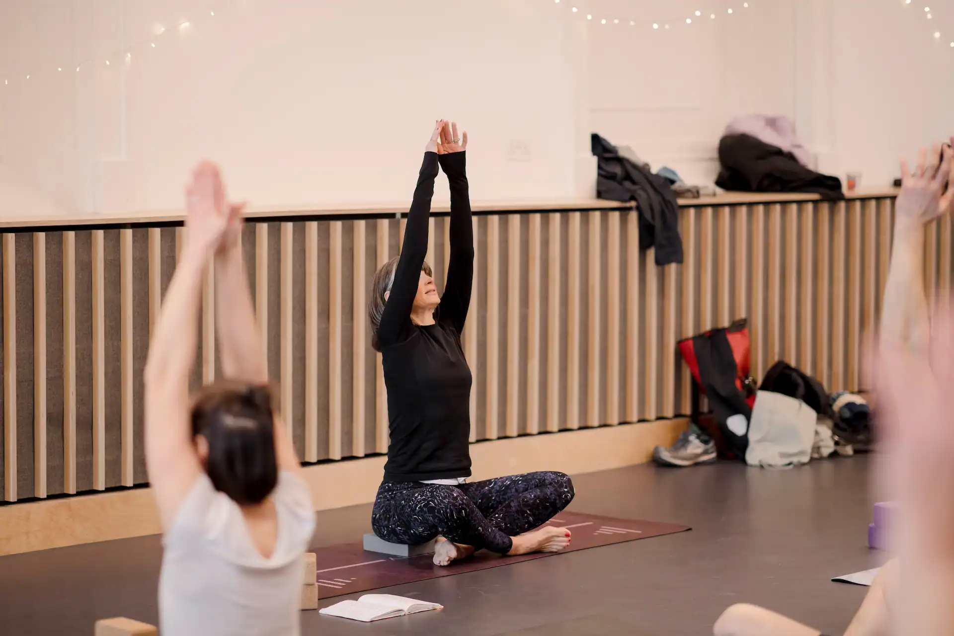 Yoga class at Pilates Plus by Tess, focusing on mindfulness and flexibility.