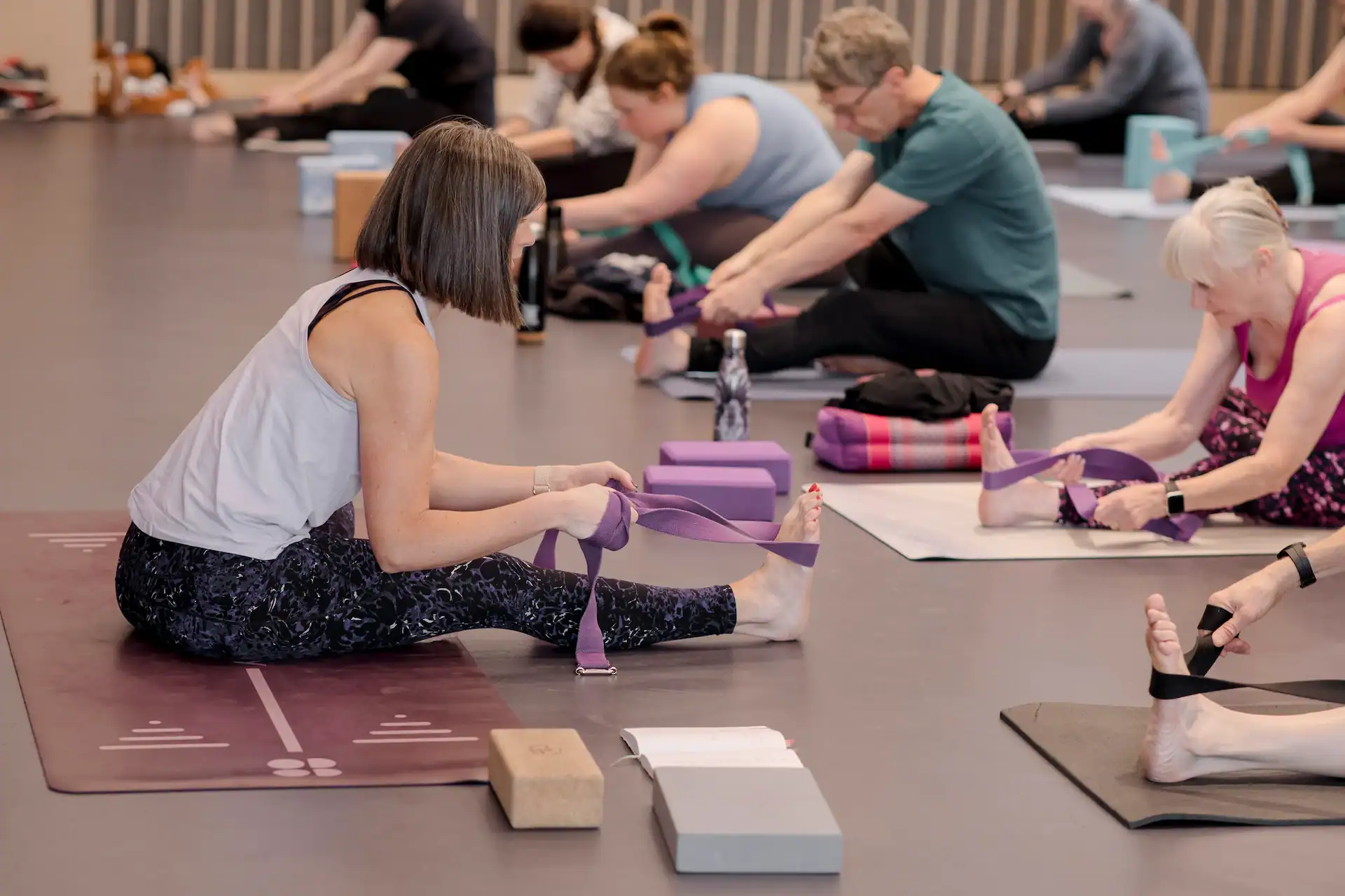 Group Pilates class focusing on flexibility and strength.